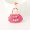Nuevo Bolso Creativo de PU Llavero de Lazo Bolso de Mano Diamante Metal Llavero Colgante Pequeño Regalo Al por Mayor