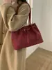 Bolsa de mão transfronteiriça nova minimalista de grande capacidade, bolsa de ombro versátil para mulheres, bolsa tote de camurça de nicho pequeno de grande capacidade