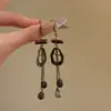 Pendientes de Madera Asimétricos Redondos con Borla Estilo Étnico Retro Diseño de Nicho Gancho de Oreja de Gama Alta Pendientes de Moda