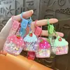 Llavero Creativo de Pastel de Crema de Gominola Relleno de Aceite Colgante Lindo para Bolso Llavero de Coche Agarrador Regalo Al Por Mayor