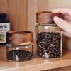 Frasco hermético de vidrio de borosilicato de alta calidad con boca roscada y tapa de haya, frasco hermético de vidrio transparente para almacenar té y café perfumados.