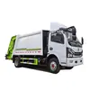Camión compactador de basura Dongfeng Yuhu de 3 toneladas Camión de recolección de residuos de 20 metros cúbicos Garantía de calidad