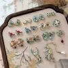 Nuevos accesorios de arte de uñas esmaltados estilo chino, con fénix de esmalte azul, borlas, perlas y diseños florales, al por mayor para decoraciones de uñas tradicionales.