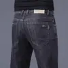 Jeans masculinos de alta qualidade para primavera e verão, corte reto, caimento slim, elástico, calça longa moderna de Guangzhou Xintang, estilo versátil de verão
