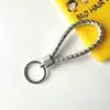 Llavero creativo de cuerda de cuero tejido a mano para pareja, llavero de coche, llavero al por mayor, colgante para bolso