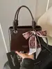 Bolso de Mano de Alta Gama Exquisito de Nicho Retro para Mujer 2026 Nuevo Estilo Coreano de Moda Textura Elegante Bolso Cruzado con Estilo para Dama