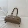 Bolso vintage de lujo ligero de nicho con patrón de diamantes para mujer, nuevo modelo 2026, bolso tipo cubo de alta gama, bolso de mano para el trabajo, moderno y versátil