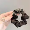 Anillo Retro de Intestino Pequeño con Perlas Negras 2025 Nueva Elegante Diadema de Gama Alta Banda Elástica Duradera para el Cabello Banda de Goma para Mujeres
