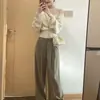 Hilo de núcleo trenzado, color albaricoque, patchwork, punto de imitación de dos piezas para mujer, hombros descubiertos, nuevo estilo de otoño, suéter de diseño irregular