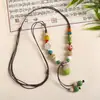 Collar con colgante de campana de mariposa de cerámica de estilo étnico retro para mujer, diseño nuevo y moderno, cadena larga para suéter, accesorios