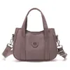 Bolsa versátil para atividades ao ar livre para mulheres, bolsa de mão compacta para senhoras, bolsa tiracolo de nylon dopamina, moderna e simples, para celular