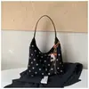 Colección de otoño 2026 transfronteriza: diseño único, gamuza de lunares, bolso de hombro color block, bolso de axila moderno y retro