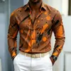 Nueva camisa de manga larga para hombre con base azul y estampado de salpicaduras naranja-amarillas, diseño audaz y llamativo, versátil para ir al trabajo