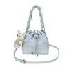 Bolso nuevo, simple y elegante, moda primavera 2026, bolso de hombro cruzado casual, bolso tipo cubo único y moderno para mujer
