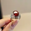 Transmisión en vivo súper ventas anillo de imitación de cristal rojo moda femenina sentido de alta gama entrelazado tejido piedra verde anillo abierto anillo de dedo ajustable