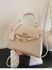 Bolsos de Mujer de Moda de Este Año 2026 Primavera y Otoño Nuevo Bolso Kelly para el Trabajo Pequeño Cuadrado Elegante de Hombro Cruzado