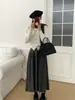 Foto real de saia feminina de malha plissada para outono e inverno, de cintura alta, saia midi evasê com caimento