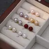 Aretes de perlas para mujer, suministro de puesto de mercado nocturno, aretes de temperamento de alto sentido, diseño de nicho, aretes de moda, venta al por mayor