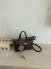 Bolso tejido de moda transfronterizo para mujer, nuevo bolso cubo de textura simple, bolso bandolera de un solo hombro vintage, moderno
