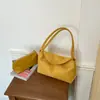 Bolso de mano simple estilo coreano al por mayor para mujer, nuevo modelo otoño 2026, bolso de hombro elegante de color liso, bolso para axila madre-hija