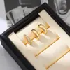 Pendientes apilables de oro de 18 quilates, juego de tres piezas, pendientes simples pulidos, pendientes de clip de lujo ligero microincrustados, juego de pendientes transfronterizos