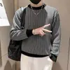 Otoño e invierno 2023 Nuevo suéter de punto grueso con cuello redondo para hombre, suéter a cuadros versátil, ajuste ceñido, manga larga, moda