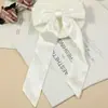 2024 Nuevo Explosiones Monocromático Largo Corbata de Lazo Flotante Pasador de Pelo Moda Popular Versátil Xiaoqing Nuevo Pasador de Pelo