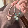 Original Elegante y Exquisito Collar de Cuatro Hojas de Trébol Calado de Colores Calabaza Piedra Natural con Cuentas Cadena de Suéter Simple de Alta Gama