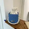 Tendência de Moda Transfronteiriça Cor Sólida Pérola Bolsa Quadrada Pequena 2025 Novo Design de Nicho Bolsa de Ombro com Corrente Versátil e Estilosa