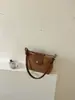 Bolsa de mano de nicho estilo coreano para commuting para mujer, nueva, casual, retro, bolsa de axila, para salir, bandolera, cruzada, moderna