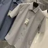 Bestseller de Verão Camisa Masculina de Manga Curta em Modal Nuvem, Gola Reversível, Camisa Branca Respirável, Estoque da Empresa Masculino, Atacado