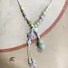 Collar con colgante de campana de mariposa de cerámica de estilo étnico retro para mujer, diseño nuevo y moderno, cadena larga para suéter, accesorios