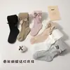 Colección de primavera y otoño transfronteriza: Leggings infantiles con diseño estilo princesa, versátiles para usar como prenda exterior, con rayas verticales y un gran moño, adecuados para niñas