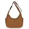 Bolsa transversal feminina 2026 nova de grande capacidade de ombro único esportiva versátil bolsa bolinho feminina casual para trabalho e dia a dia mochila