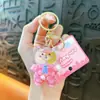 Llavero de Oso con Pajarita de Gelatina de Frijol de Caramelo Llavero de Botella de Arena Movediza Colgante Acrílico Regalo Pequeño Venta al por Mayor