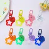 Llavero con hebilla de puerta giratoria, colgante de pentagrama y corazón transparente de colores, accesorio hecho a mano para bolsos