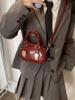 Bolso de mujer 2024 nueva moda textura nicho primavera y verano versátil hombro mensajero bolso pequeño rojo portátil de mujer