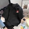 Venta al por mayor de fábrica verano todo partido holgado coreano hoja de arce letra inglesa impresa camiseta de cinco mangas cuello redondo
