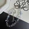 Cadena para teléfono de estilo de lujo ligero, con forma de corazón transparente, borla de copo de nieve, llavero de cristal corto de moda, accesorio para bolso