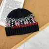 Gorro de punto con dobladillo de copo de nieve de cuatro colores para niños 2025 Nuevo Ambiente Retro Gorro de lana tejido jacquard para bebé niño