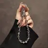 Lanyard de cristal de alta gama moda lujo decoración para teléfono móvil anti-pérdida muñeca lanyard corto hecho a mano con cuentas hebilla de metal