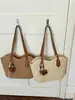 Bolso de paja con borlas transfronterizo, nuevo bolso tejido de paja, bolso de playa para vacaciones, bolso de hombro versátil, bolso tote de verano para el día a día
