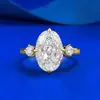 Joias Mu Jing novo anel de prata S925 banhado a ouro com incrustação de diamante de alto carbono corte flor de gelo oval 8*12 anel cruzado venda quente transfronteiriça