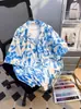 Camisa de Praia Floral Azul de Verão Estilo Sanya Hawaii Férias Preguiçosa Retro Solta Camisa para Casal