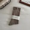 Calcetines sin costuras para mujer, engrosados y de caña alta para primavera y otoño, calcetines holgados para maternidad, calcetines holgados de color liso versátiles estilo japonés, calcetines largos Maillard