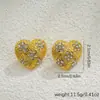 Pendientes Europeos y Americanos Transfronterizos de Oro de 18 Quilates en Forma de Corazón Pendientes de Flores de Moda Corazón Completo de Diamante Pendientes de Diseño Nicho de Lujo Ligero