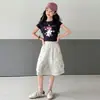 2026 Nuevo Estilo Conjunto Casual para Niñas Estilo Coreano Dibujos Animados Conjunto de Manga Corta con Pantalones Cargo Conjunto de Dos Piezas para Niños Mayores