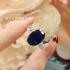 Anillo Diario Estilo Mid-Century Vintage de Huevo de Paloma con un Toque de Alta Gama, Anillo para Mujer de Diamante Azul de Espinela de Alto Carbono Que Cambia de Color Bajo la Luz