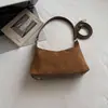 Otoño 2026 Nuevo Estilo Coreano Retro Color Sólido Simple Bolso de Hombro Tipo Dumpling Bolso de Mano para Viajes de Negocios Gamuza Bolso de Hombro de Moda