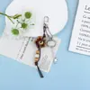 Creativo Nuevo Estilo Coreano Resina Estrella Bola Cerámica Lanyard Llavero Accesorio Cadena Teléfono Móvil Decoración Colgante